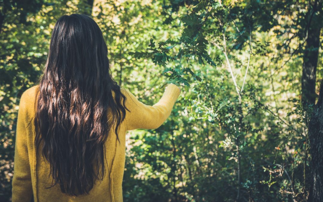Young girl with long hair, enjoying nature